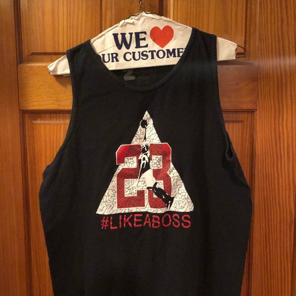 Black tank top with Jordan dunking
